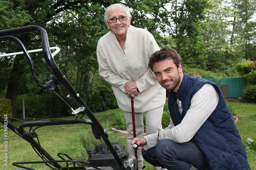 Son helping Mother in the garden photo