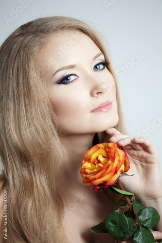 Beautiful woman with a rose