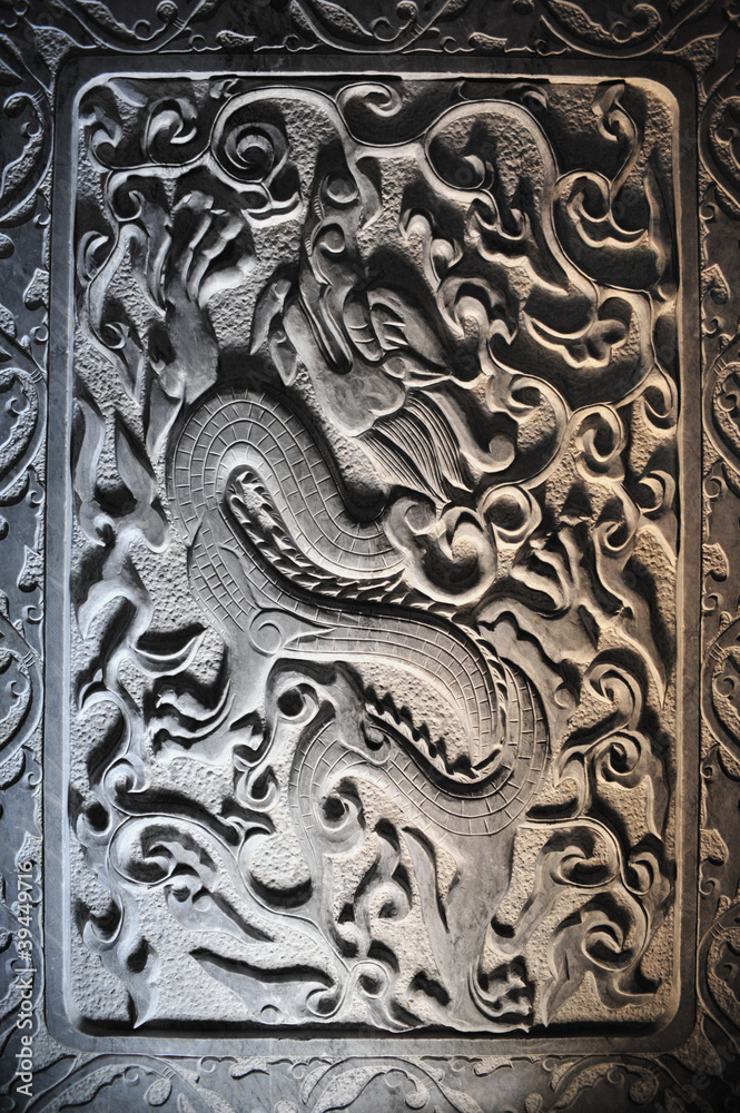 Dragon stone sculpture on wall, China