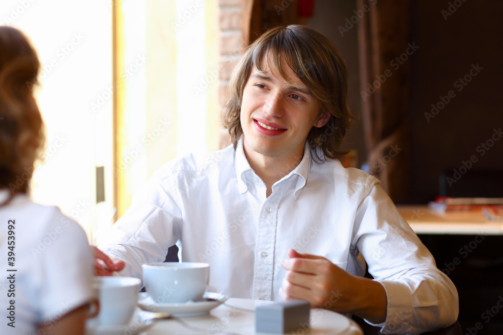 Young handsome man sitting in restaurant Young handsome man sitting in restaurant