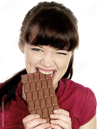 Young Woman Eating Chocolate. Model Released