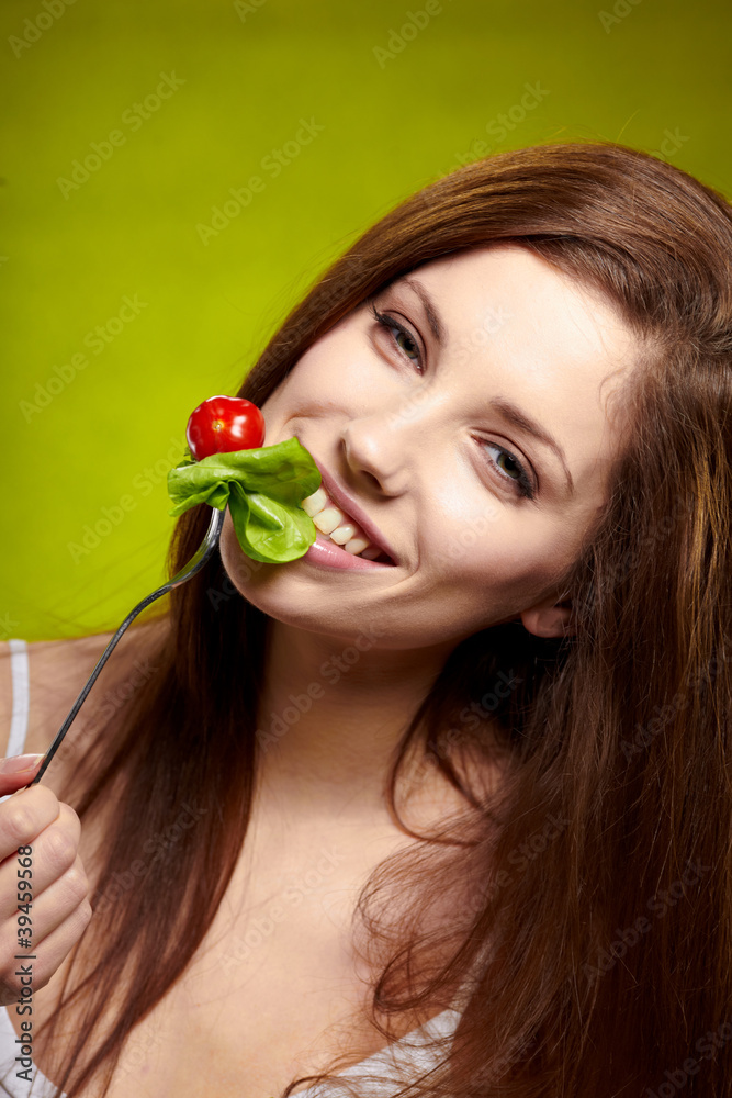happy healthy woman with salad on green background happy healthy woman with salad on green background