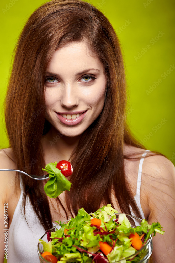 happy healthy woman with salad on green background happy healthy woman with salad on green background