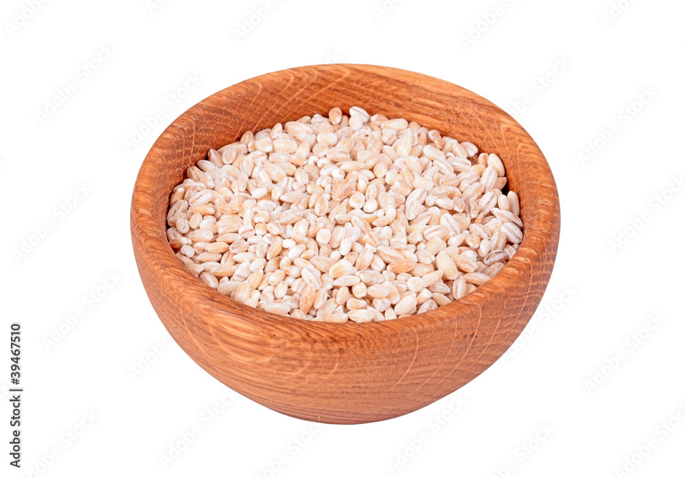 Wheat in a wooden bowl, isolated on white background Wheat in a wooden bowl, isolated on white background