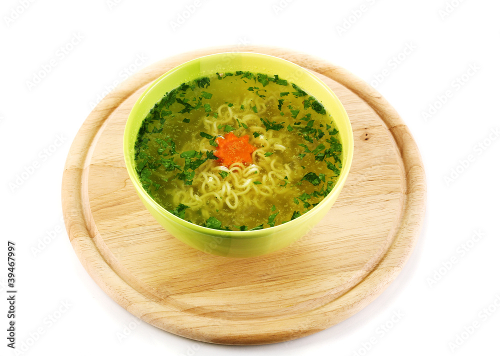 Tasty soup on wooden round board isolated on white Tasty soup on wooden round board isolated on white