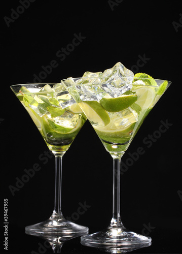 glasses of cocktails with lime and mint on black background #39467955
