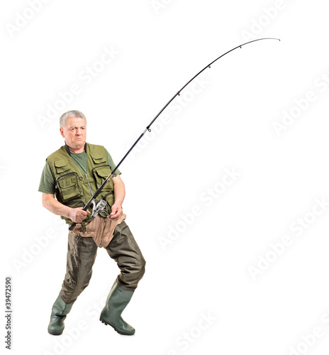 Mature fisherman holding a fishing pole