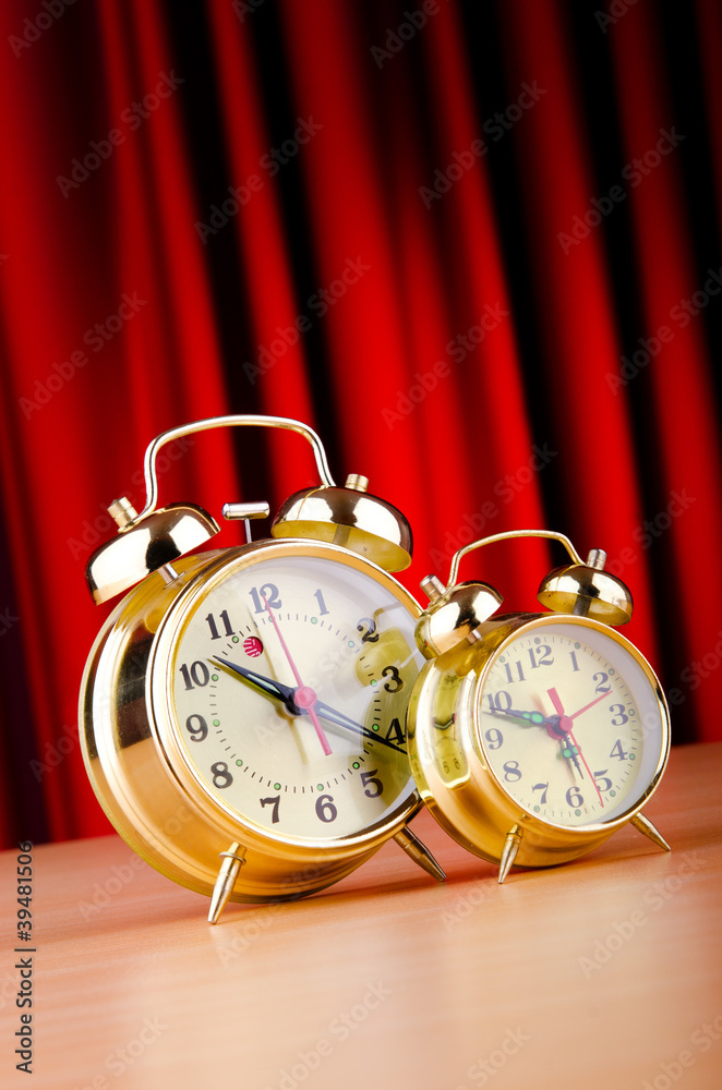 Alarm clock against curtain Alarm clock against curtain