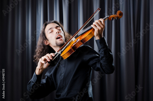 Young violin player playing