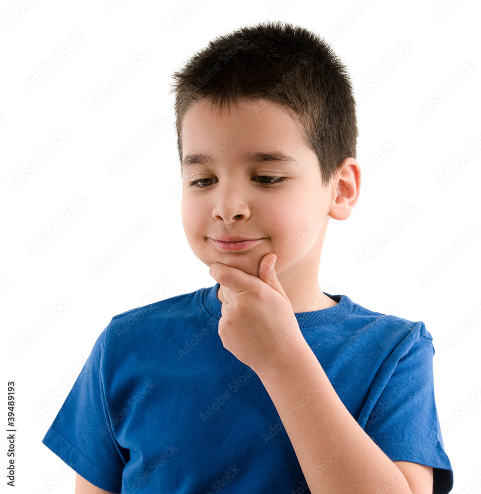 Child thinking with hand on his face Child thinking with hand on his face