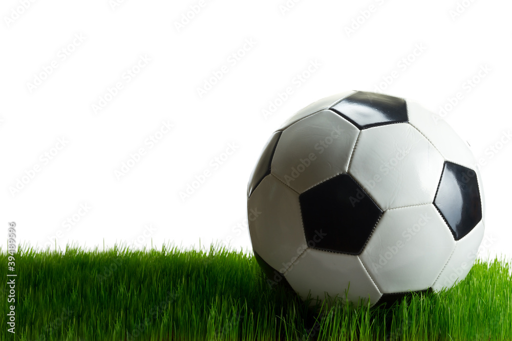 Soccer ball on the grass isolated on white Soccer ball on the grass isolated on white