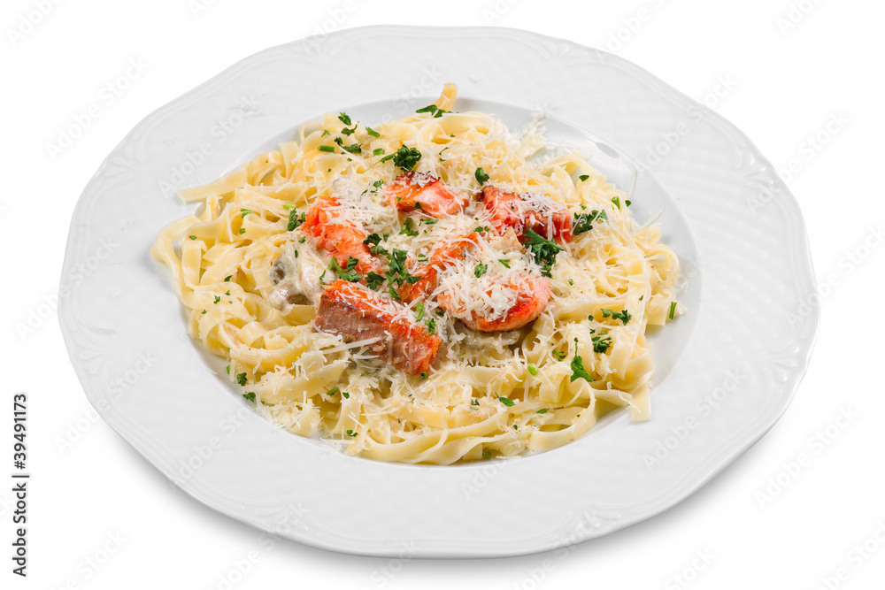 pasta with slice of salmon fish and parmesan, on white plate, is