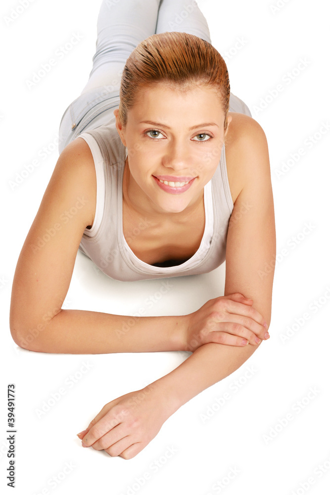 Portrait of a smiling young woman lying on the floor Portrait of a smiling young woman lying on the floor