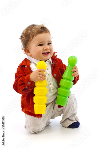 Slika na platnu Boy playing with two skittles