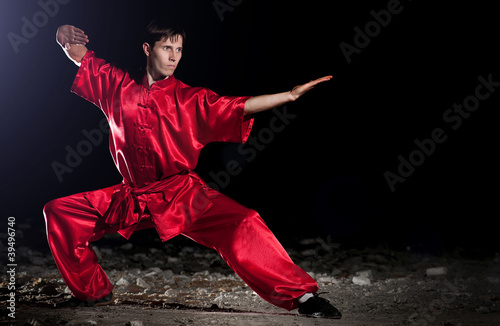 Wushoo man in red practice martial art photo