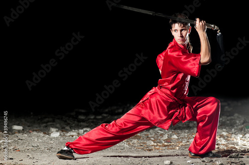 Wushoo man in red practice martial art photo