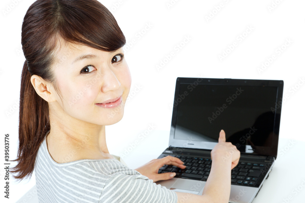 Beautiful asian woman using a laptop computer Beautiful asian woman using a laptop computer