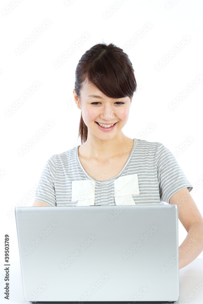 Beautiful asian woman using a laptop computer Beautiful asian woman using a laptop computer