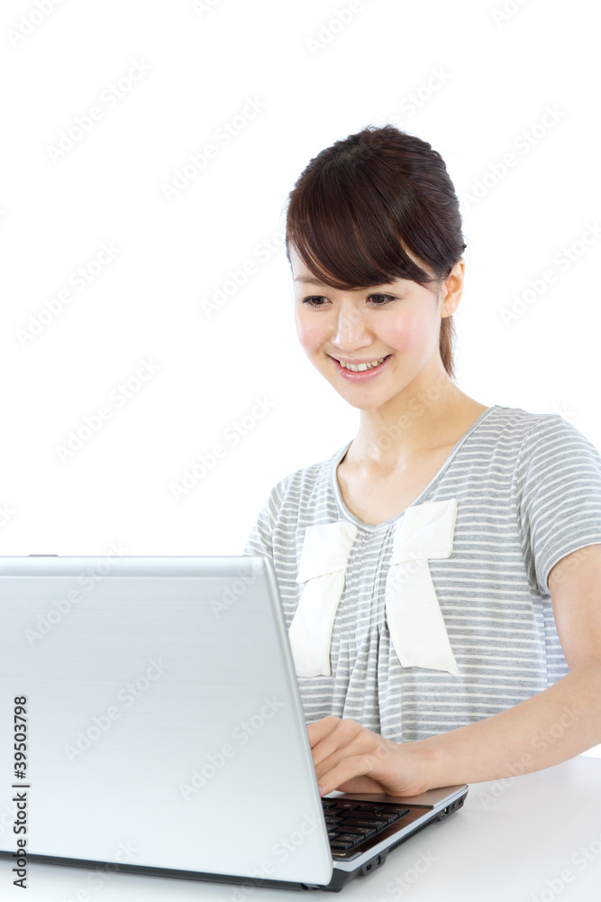 Beautiful asian woman using a laptop computer Beautiful asian woman using a laptop computer