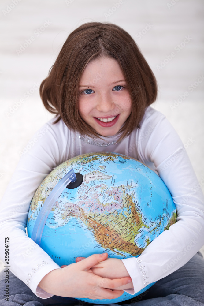 Young girl hugging earth globe Young girl hugging earth globe