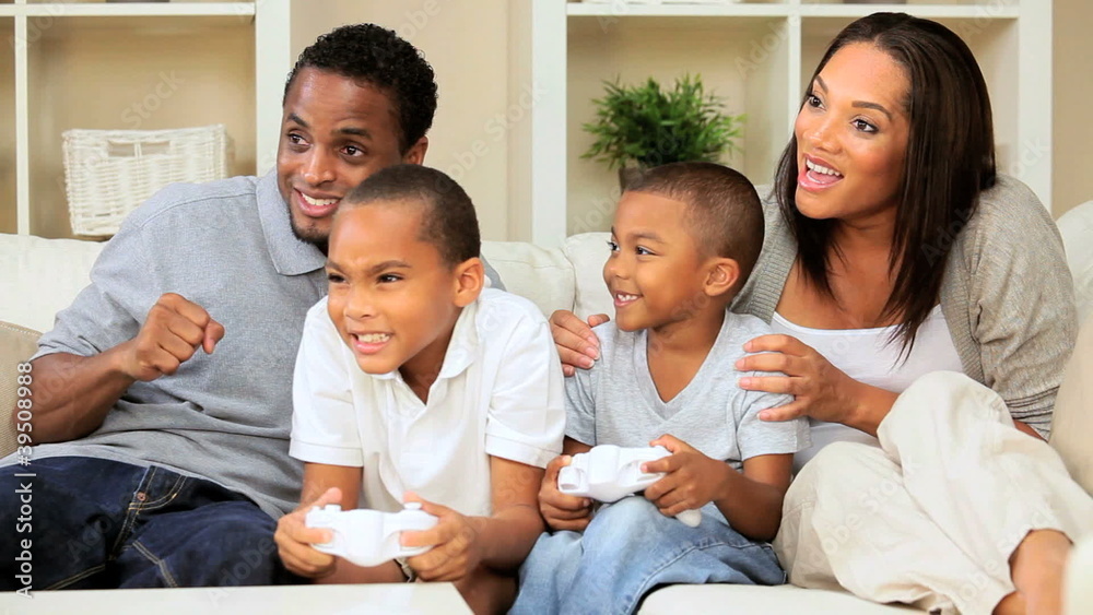 Young Ethnic Family Playing Electronic Games Young Ethnic Family Playing Electronic Games