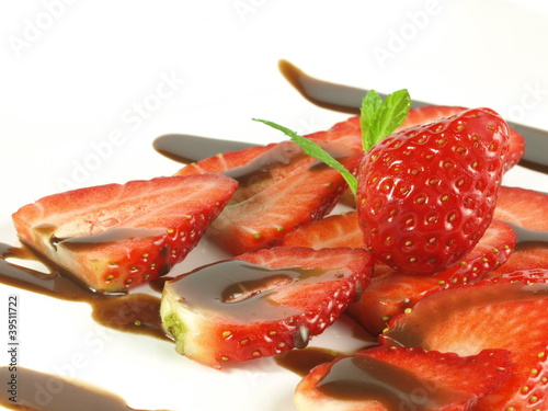 Strawberries with chocolate topping on isolated background