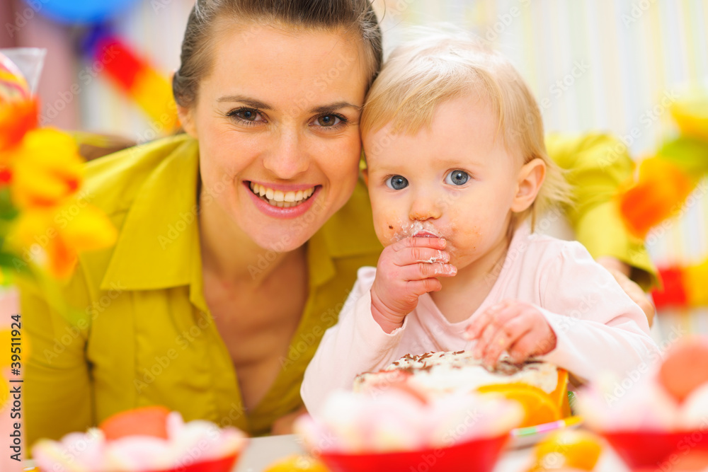 Happy mother and baby on first birthday celebration party Happy mother and baby on first birthday celebration party