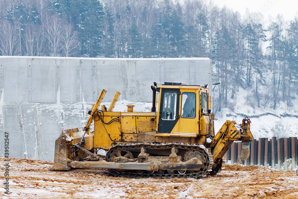yellow bulldozer working in the winter yellow bulldozer working in the winter