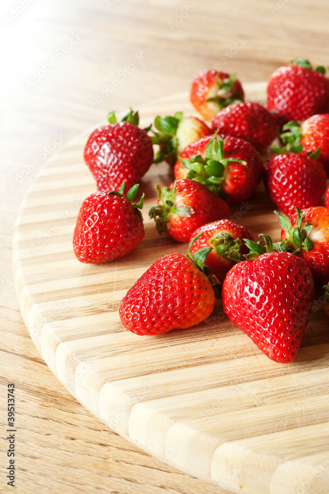 Strawberries on a chopping board