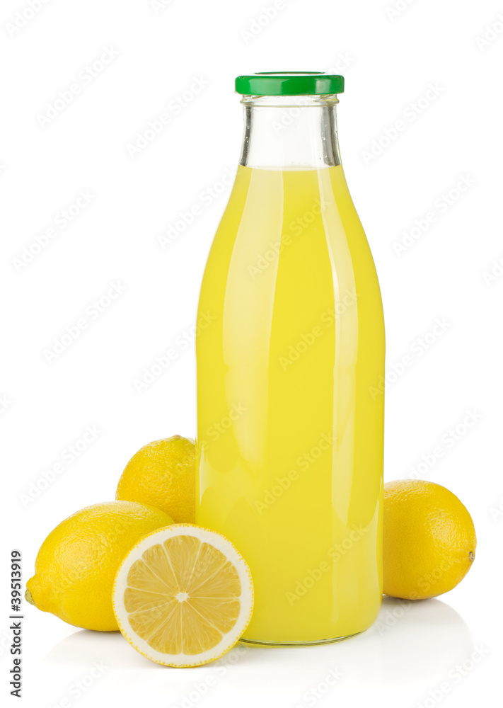 Bottle of lemon juice and fresh lemons Bottle of lemon juice and fresh lemons