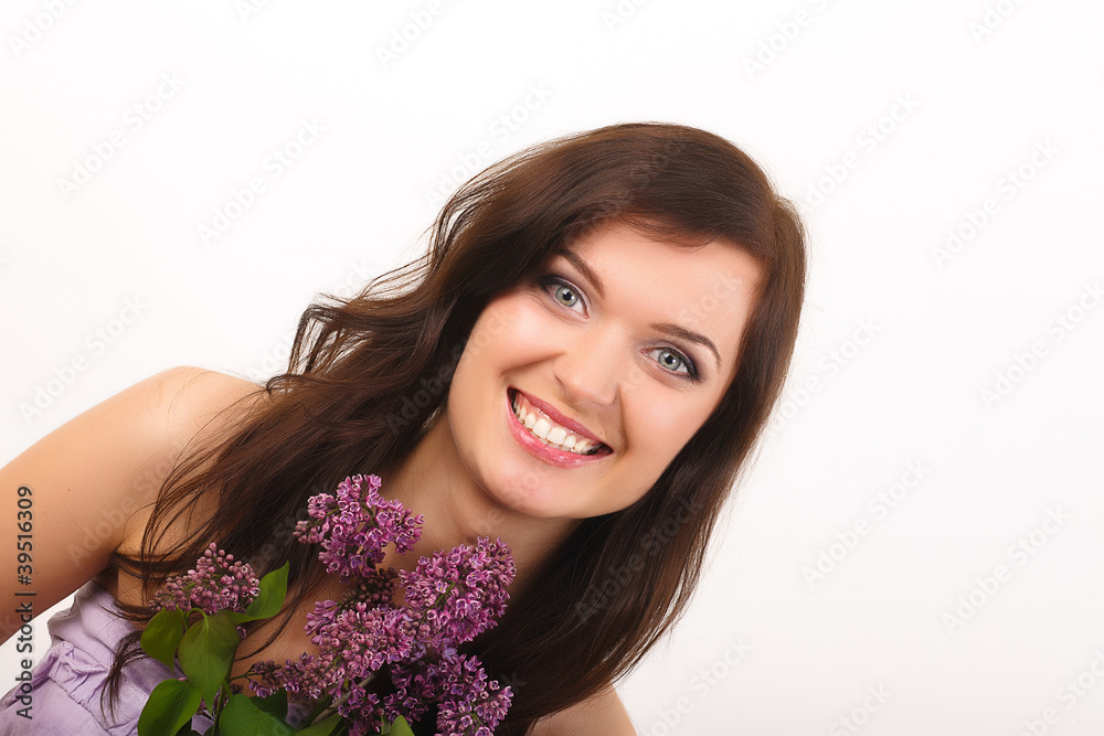 Beautiful women with lilac flowers and with purple makeup Beautiful women with lilac flowers and with purple makeup