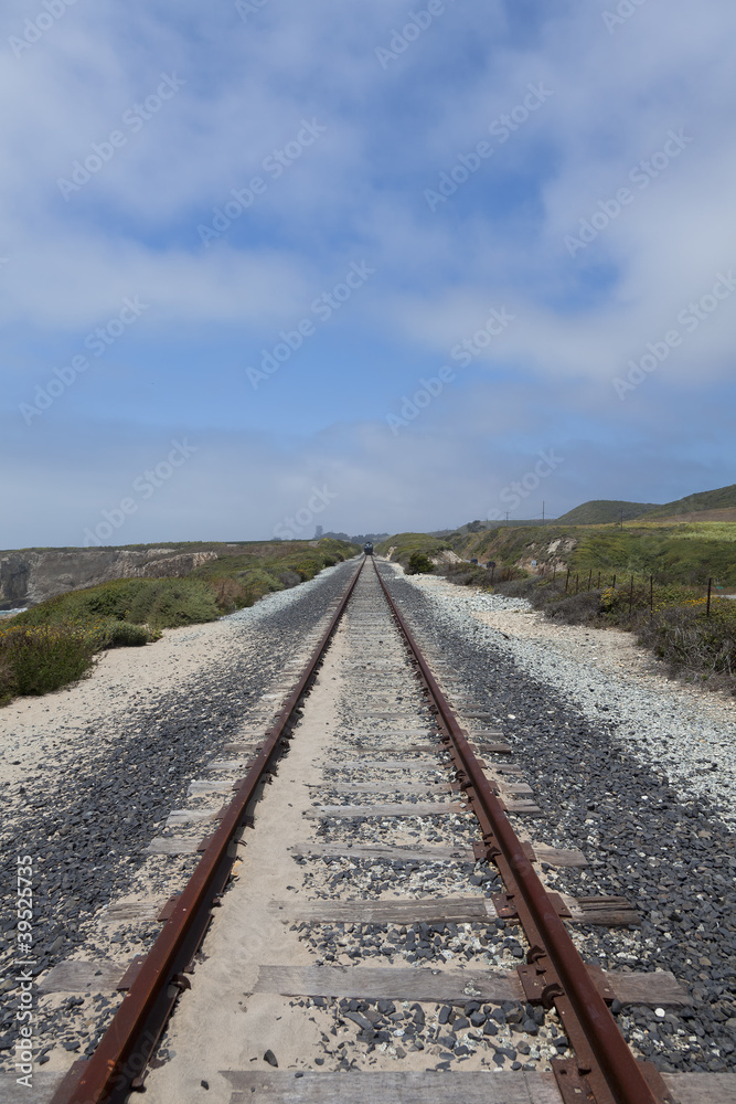 sand on railroad tracks along california coast
