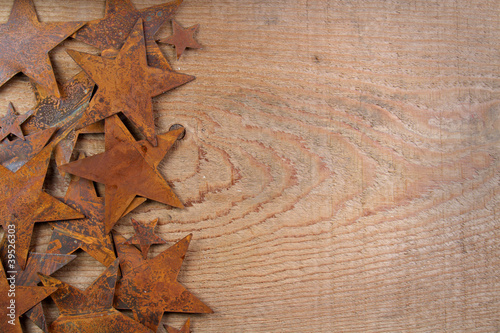Rusty stars on a wooden background