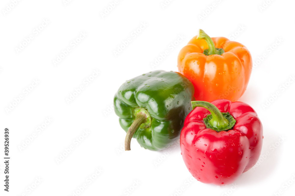 Three bell peppers of different color, isolated over white Three bell peppers of different color, isolated over white