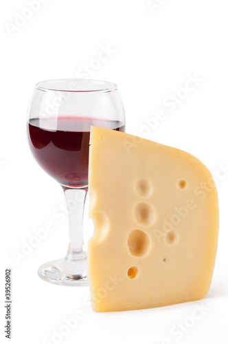 Maasdam cheese and a glass of red wine, isolated on white