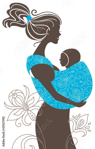 .Beautiful mother silhouette with baby in a sling