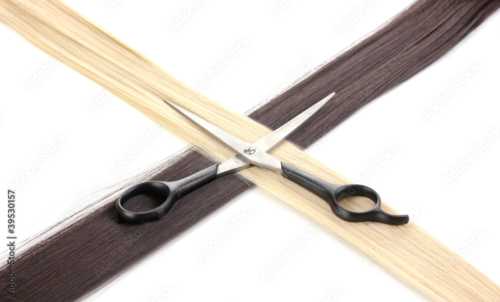 Shiny blond and brown hair with hair cutting shears isolated Shiny blond and brown hair with hair cutting shears isolated