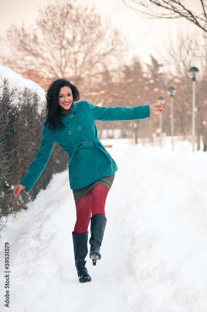 Portrait of beautiful girl in winter time walking in the snow. Portrait of beautiful girl in winter time walking in the snow.