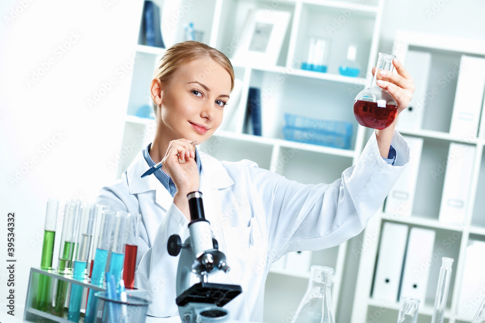 Young scientist working in laboratory Young scientist working in laboratory