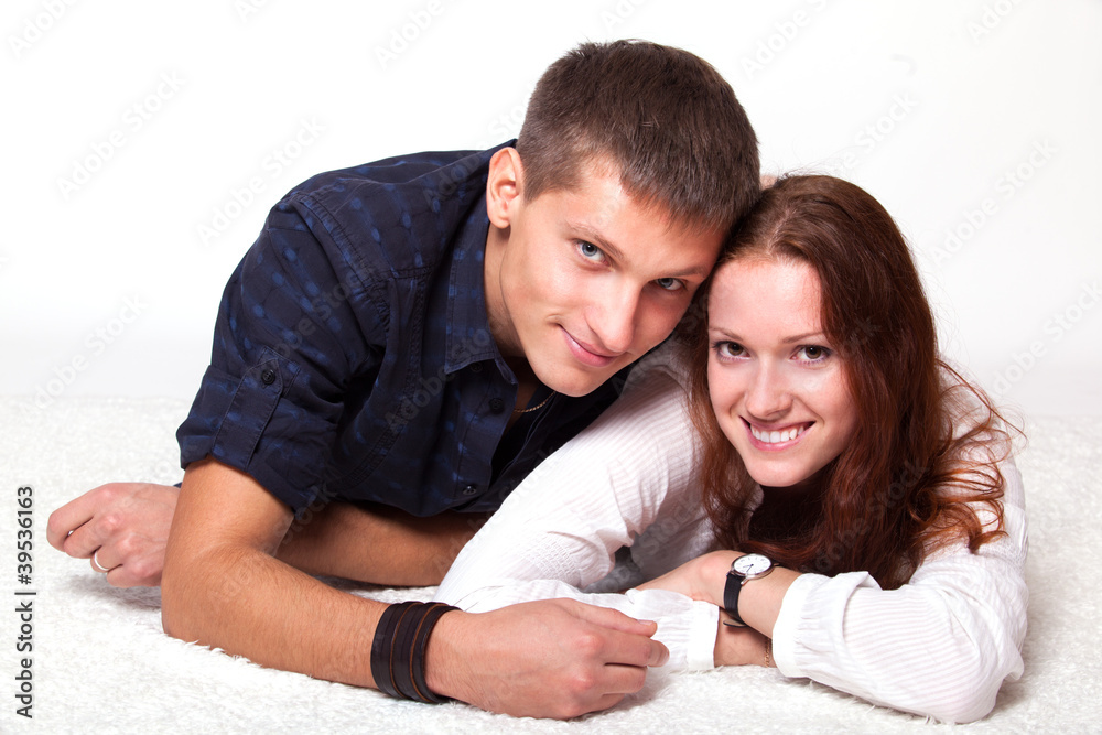 young man embraces woman