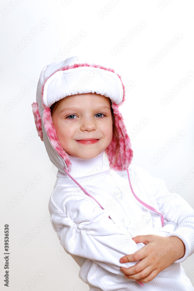 Kid in winter wear against white background Kid in winter wear against white background