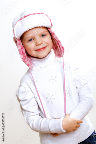 Kid in winter wear against white background