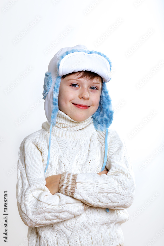 Kid in winter wear against white background Kid in winter wear against white background