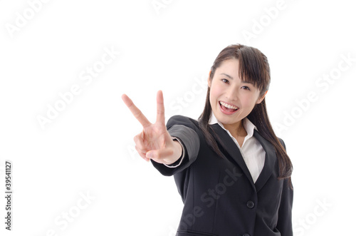 a portrait of asian businesswoman showing v sign