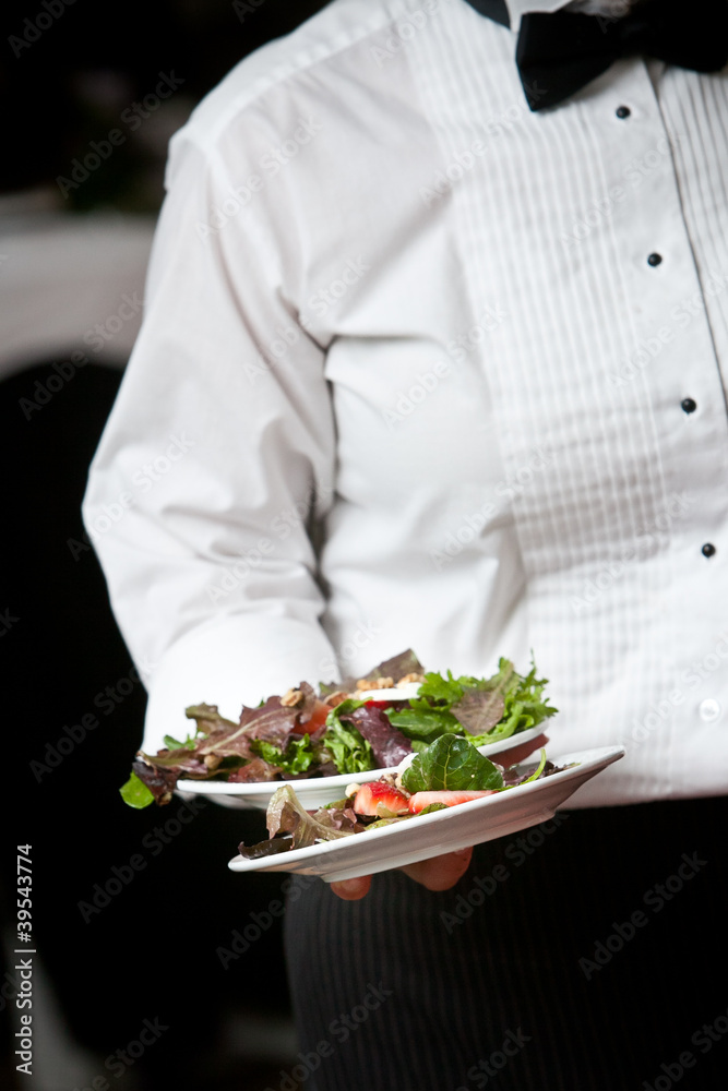 Food being served by a waiter Food being served by a waiter