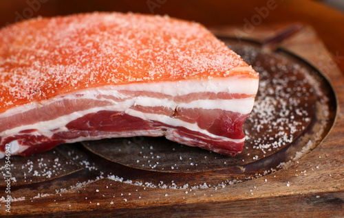 Piece of salted raw pork belly ready for baking