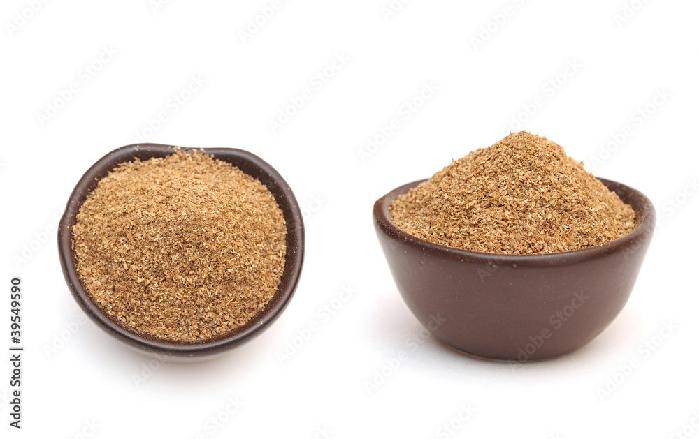 coriander powder in a clay bowl coriander powder in a clay bowl