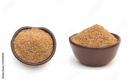 coriander powder in a clay bowl photo