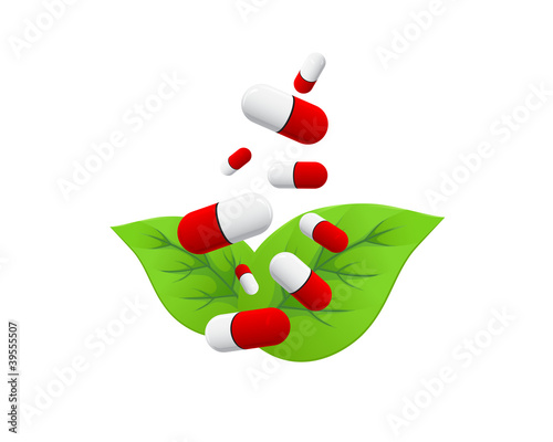 Red white pills falling on green leaves
