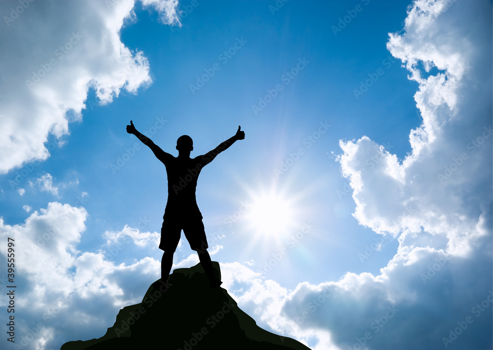 Man on top of mountain.